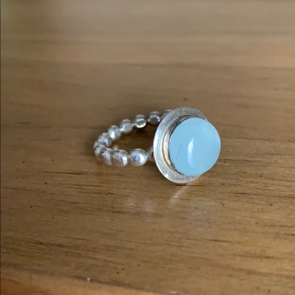 Ring with large, round blue stone